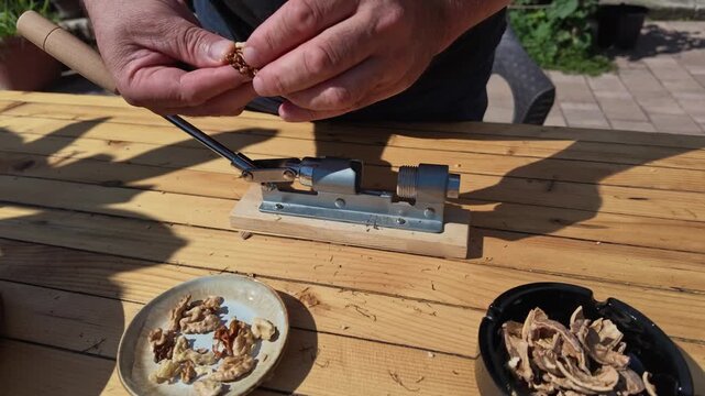 POV Slow Motion Video of Man Using Nutcracker at Table Today
