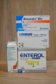 Polish Amotaks Dis, Cirrus, Enterol and Pronasal medicine boxes stacked on a wooden surface