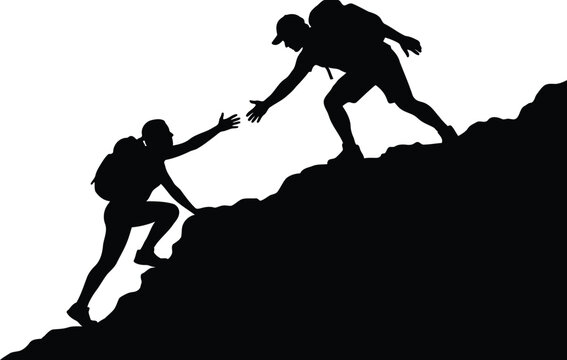 Hikers helping each other climb mountain peak silhouette showing