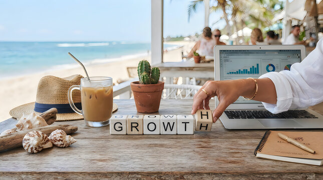 Hand placing a wooden block to complete the word growth on a sunny beach office desk workspace