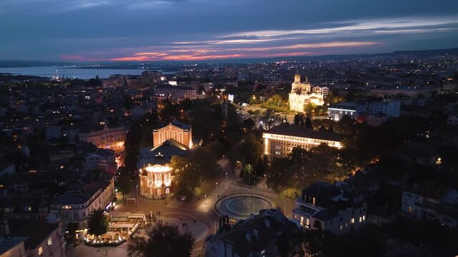 Aerial view of Varna drama theater and cathedral illuminated at dusk, Bulgaria