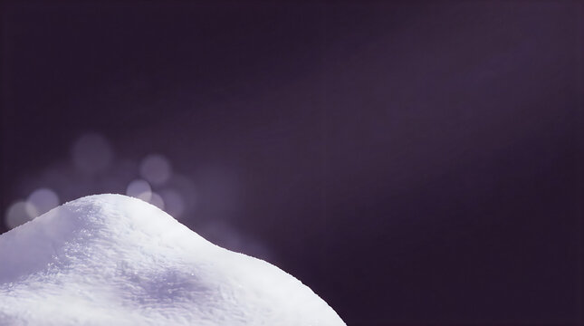 Snow drift against a dark purple surface with soft out of focus light spots with blurry light circles christmas background