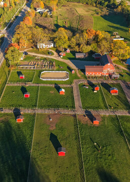 Aerial view rural farm green fields red barns