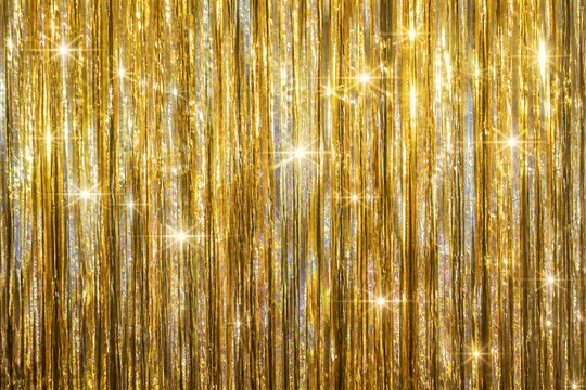 Gold tinsel curtain sparkling with reflected light background
