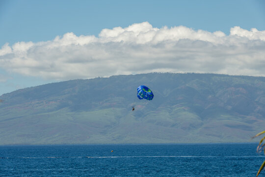 Parasailing on Maui, Hawaii, with Lanai island visible in the background