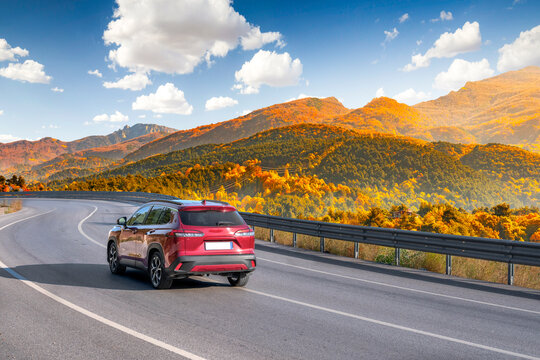 car drive on autumn road in beautiful nature. autumn colors in beautiful mountain road landscape. autumn landscape on the highway in forest. nature trip in fall. Autumn panorama on highway landscape.