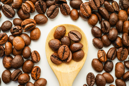 Roasted coffee beans isolated on white background, civet coffee