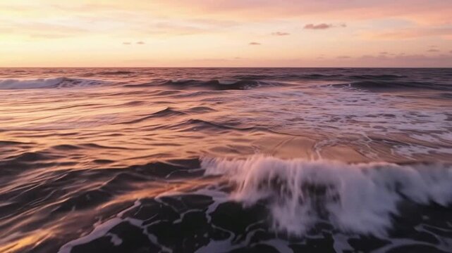 Rip current flowing in ocean water during sunset with golden light