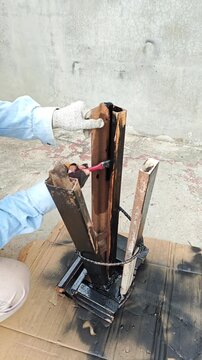 Applying Black Protective Paint to Rusted Iron Legs