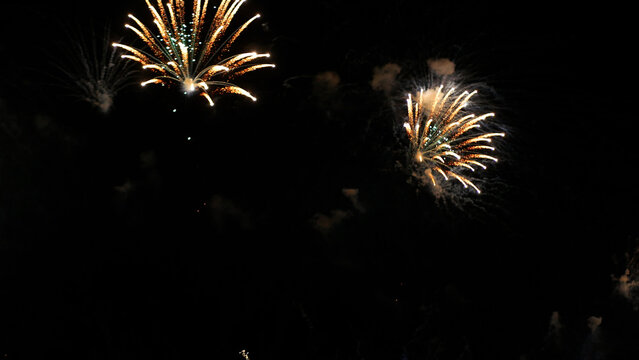 Golden Firework celebrate anniversary happy new year 2026, 4th of july holiday festival. Gold firework night time celebrate national holiday. Happy new year 2026, 4th of july holiday black background