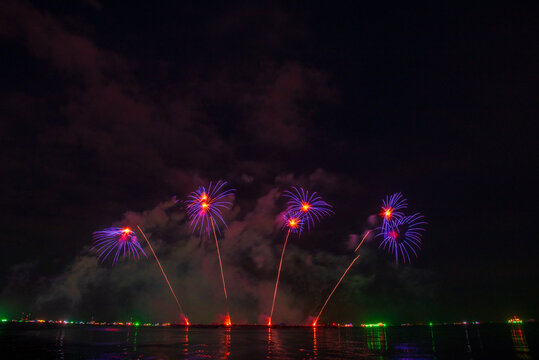 Purple Firework celebrate anniversary happy new year 2027, 4th of july holiday festival. Purple firework in night time celebrate national holiday. Violet firework Countdown to new year 2026 festival