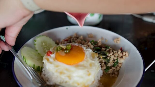 Adding Fish Sauce to Thai Pad Krapow Minced Pork Rice