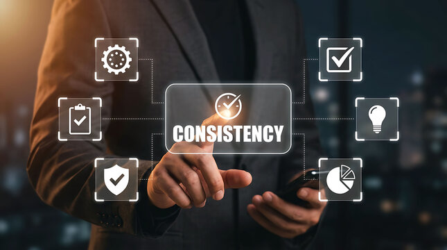 Businessman touching consistency concept with digital icons in modern office
