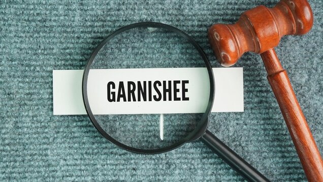 A judge&rsquo;s gavel and documents referencing "Garnishee" or "Garnishee Proceedings"&mdash;a court enforcement method that allows a judgment creditor to recover a debt directly from a third party who holds mone