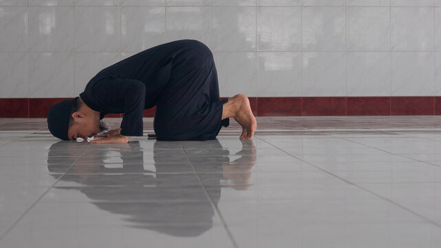 Muslim Man Praying in a Mosque