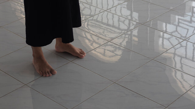 The feet of a Muslim man performing prayer