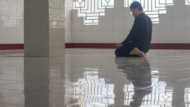 Muslim Man Praying Inside a Mosque