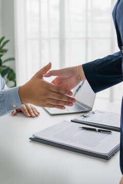 Asian business people shaking hand
