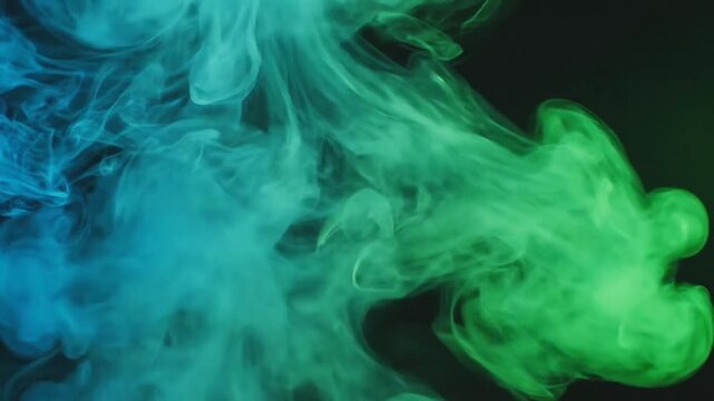 Abstract Blue and Green Smoke Swirls Against Dark Background.