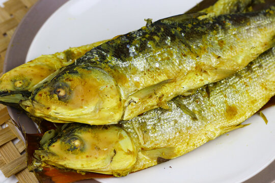 Traditional Indonesian presto milkfish cooked under pressure until tender, with softened edible bones. A popular local seafood dish known for its savory flavor and nutritious protein.
