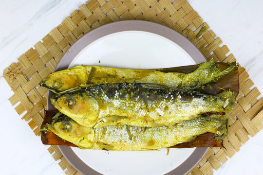 Traditional Indonesian presto milkfish cooked under pressure until tender, with softened edible bones. A popular local seafood dish known for its savory flavor and nutritious protein.