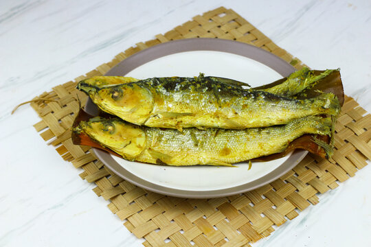 Traditional Indonesian presto milkfish cooked under pressure until tender, with softened edible bones. A popular local seafood dish known for its savory flavor and nutritious protein.