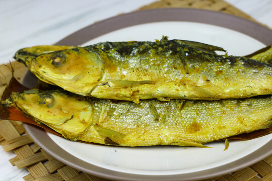 Traditional Indonesian presto milkfish cooked under pressure until tender, with softened edible bones. A popular local seafood dish known for its savory flavor and nutritious protein.