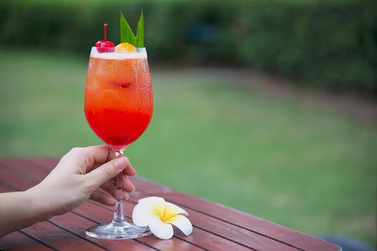 Cocktail recipe name mai tai or mai thai worldwide favour cocktail include rum lime juice orgeat syrup and orange liqueur - sweet alcohol drink with flower in garden relax vacation concept