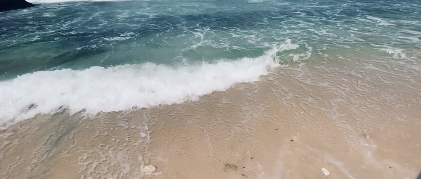 waves on the white sand beach