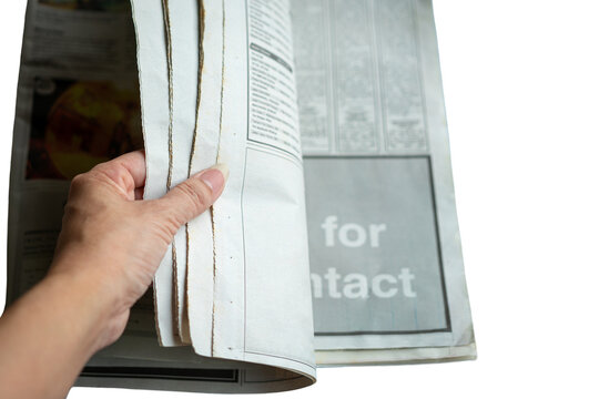 Hand turning pages of newspaper, top view. Isolated on transparent background.