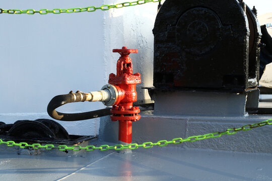 red marine fire hydrant with pipe