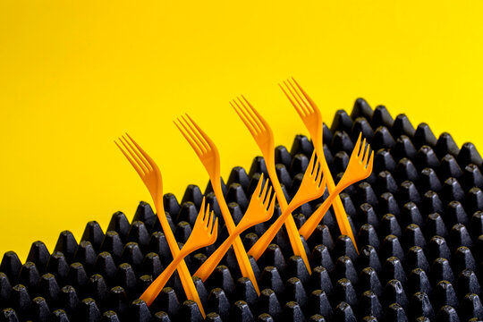 Abstract still life with yellow forks, top view