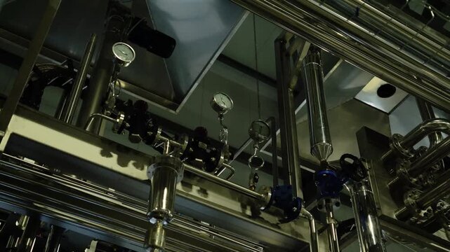 Stainless steel pipes and pressure gauges in industrial plant