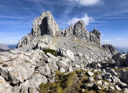 Scenic view of mountain peak Hochturm in Hochschwab region, Styria, Austria. Steep rocky cliffs covered in deciduous trees in vibrant autumn colors. Wanderlust Austrian Alps.