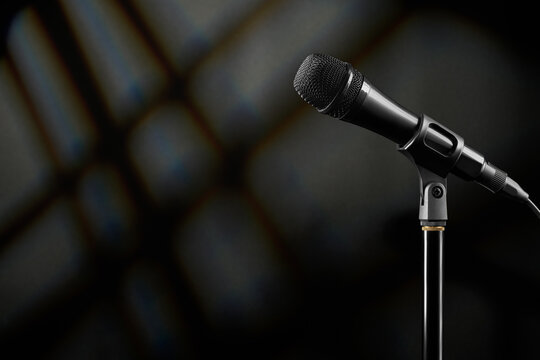 Microphone on stand ready for speaking or singing in studio.