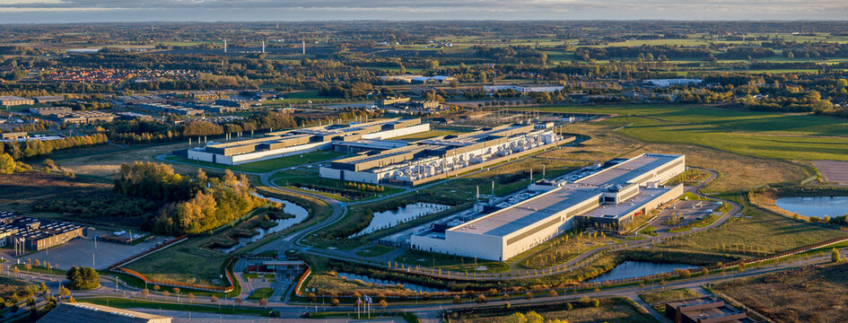 Data center campus with server buildings,cooling systems and technological infrastructure integrated with sustainable green spaces in Odense, Denmark.