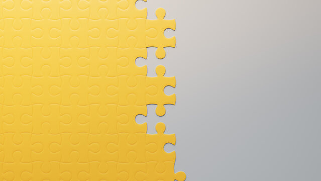 Partially Completed Yellow and White Jigsaw Puzzle Background with copy-space. Growth Concept.