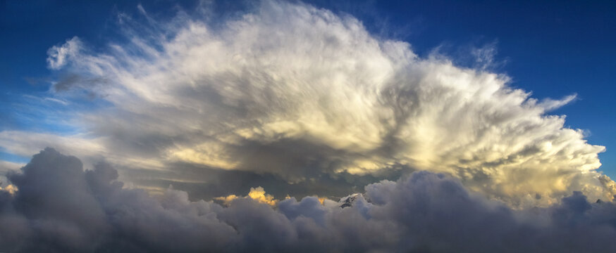 Dramatic panoramic cloudscape against a blue sky