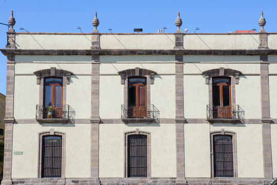 Elegant Historic Building Facade with Wrought Iron Balconies