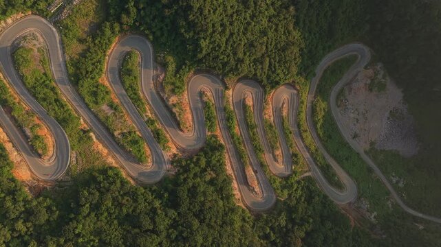 Stunning aerial top down view of the famous khau coc cha mountain pass in vietnam, featuring its winding road and hairpin turns