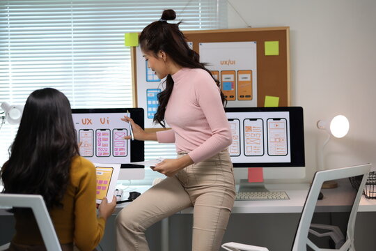 Woman collaborating on UX UI app design.