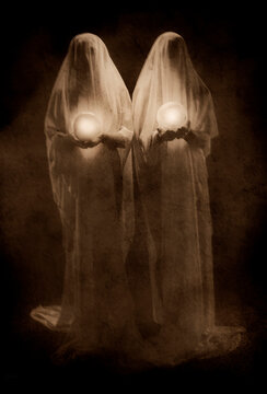 Two ghost figures holding glowing orbs against dark background