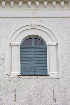 Closed Wooden Window Shutters at White Church in Stromstad Sweden