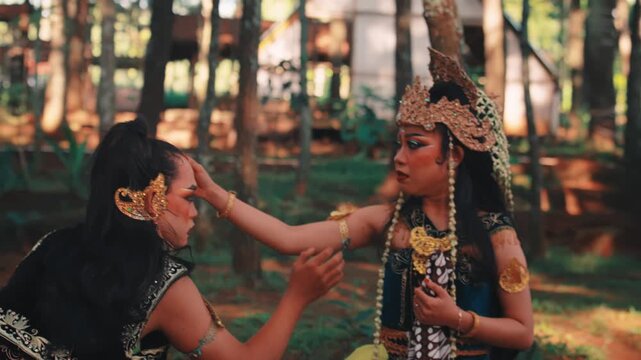Traditional Javanese Dancers in an Emotional Scene Outdoors