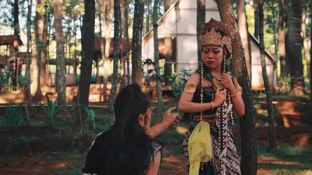 Emotional Farewell Between Two Javanese Dancers in a Forest