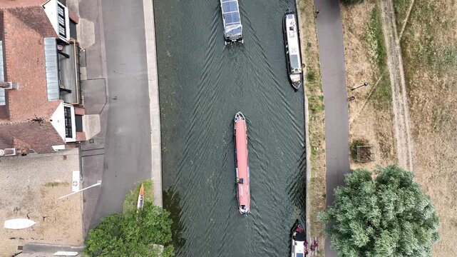 An overhead view of punts riverside paths and trees along the River Cam in Cambridge England United Kingdom