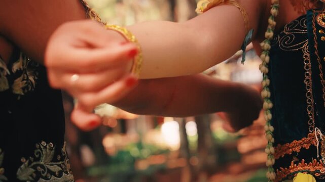 Close-up of Synchronized Arm Movements in Javanese Dance