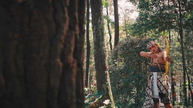 Javanese Archer Aiming Bow from Behind a Tree