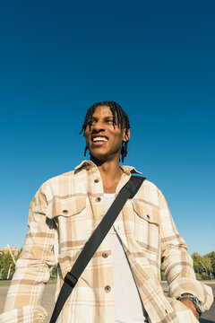 Young black man laughing enjoying urban lifestyle