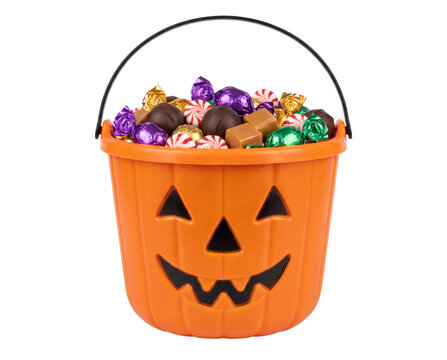 Halloween pumpkin bucket containing assorted chocolate candy